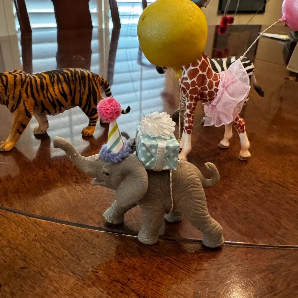 Zebra, tiger, elephant, and Giraffe Figurines